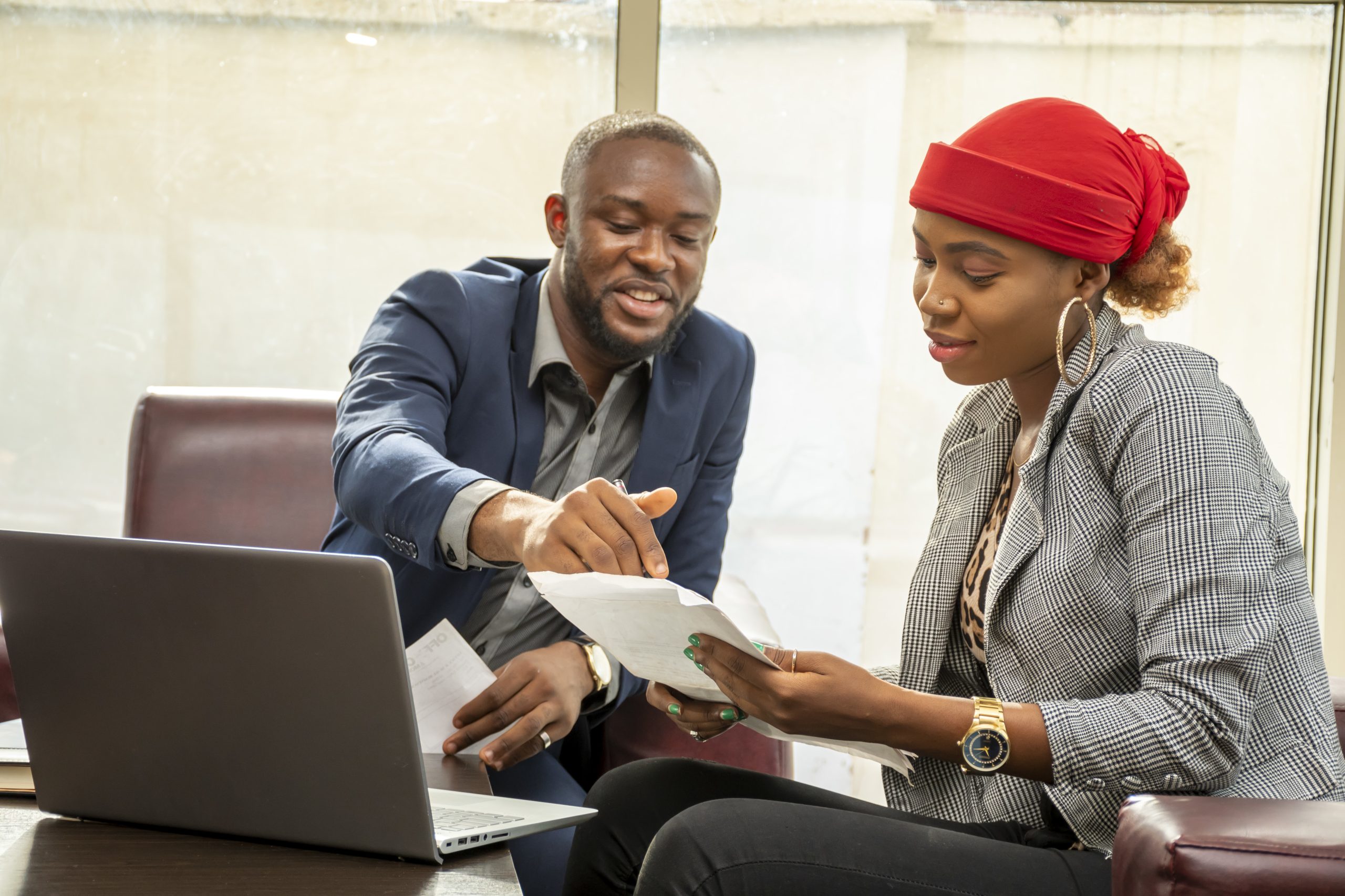 Young black business man and woman working together