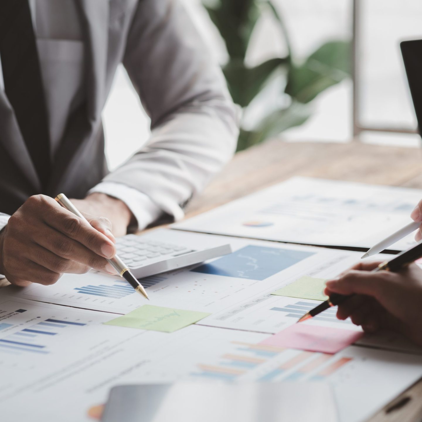 Atmosphere of a startup company meeting, business people are meeting together to summarize and plan investment finances, they are the founders of the company. Business administration concept.