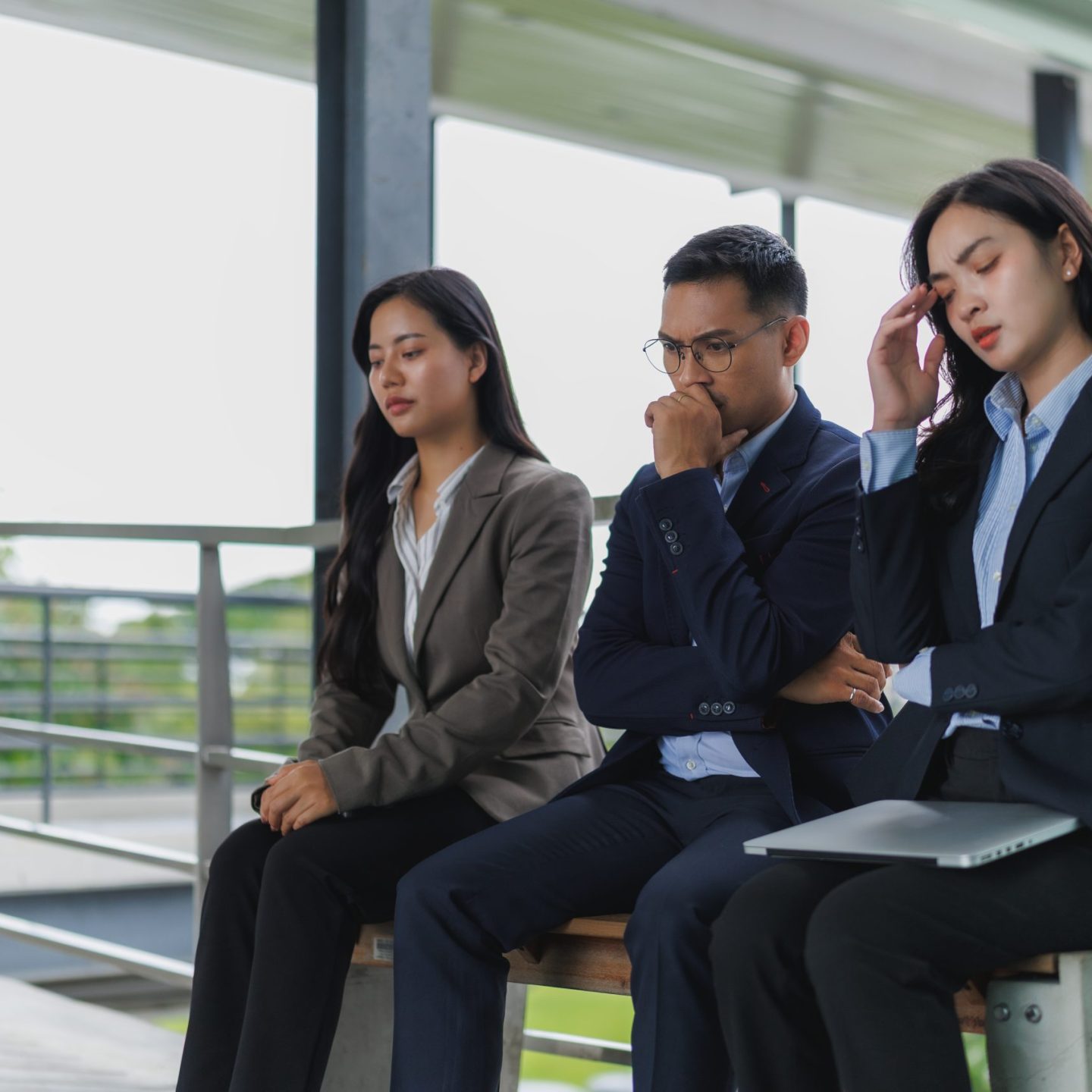 Business team feeling stressed and serious while thinking about new project and having headache with financial problem